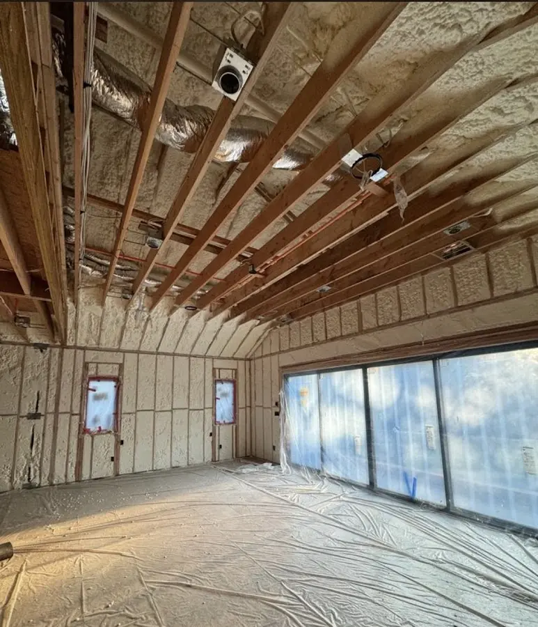Interior walls and ceiling insulated with spray foam during new construction in Claverack